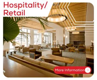 Spacious, modern hospitality lobby with wooden furniture, large windows, and warm lighting.