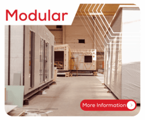 Several modular buildings under construction inside a large industrial warehouse, with Modular text above.