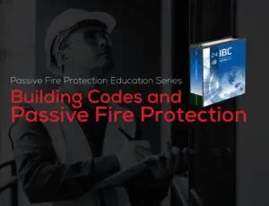 Worker in safety gear writes beside book titled Passive Fire Protection and Building Codes.