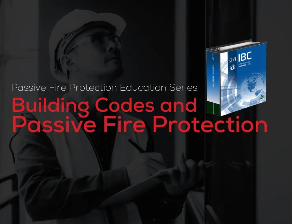 Worker in safety gear writes beside book titled Passive Fire Protection and Building Codes.