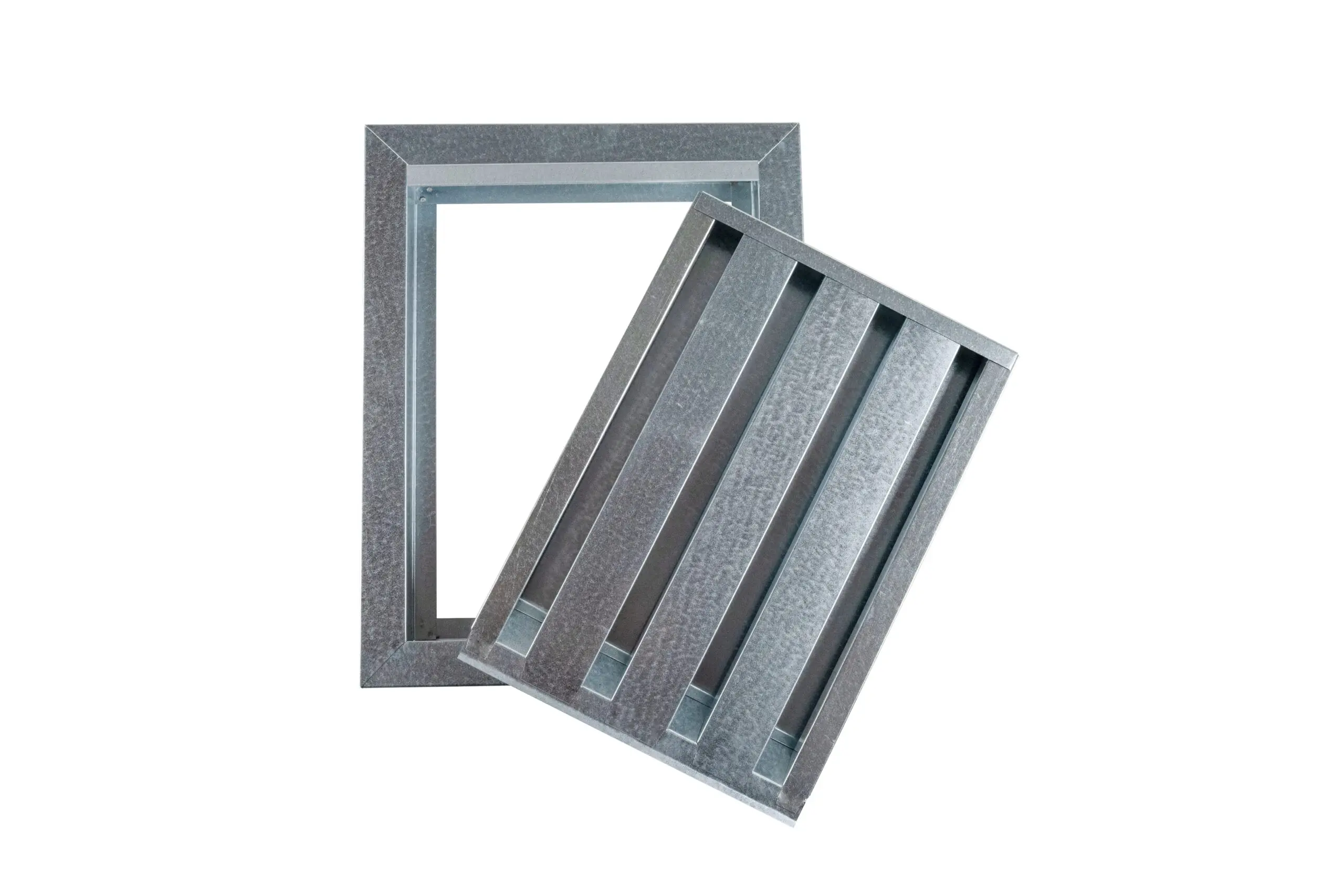 Two metal air vent covers, one standing and one leaning, on a white background.