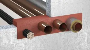 Cross-section of pipes and cables passing through a firestop barrier in a concrete wall.