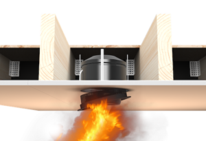 Cross-section of a ceiling showing fire below and a round vent with protective casing between wooden beams.