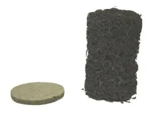 A round, flat pellet and an expanded cylindrical mass of coir against a white background.