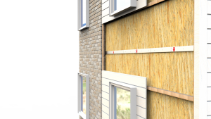 Cutaway view of a building wall showing brick, insulation, fire barrier, and wooden siding layers with windows.