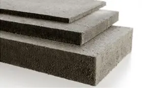 Three stacked gray insulation boards of varying thickness on a white background.