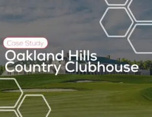 Oakland Hills Country Clubhouse with green lawn and building, text overlaying the image.