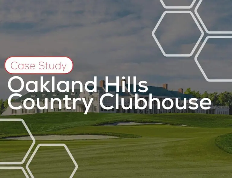 Oakland Hills Country Clubhouse with green lawn and building, text overlaying the image.