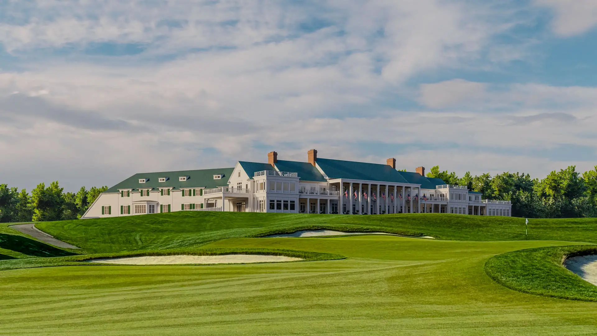 White country club with green roof, golf course, bunkers, and fireblock features visible.