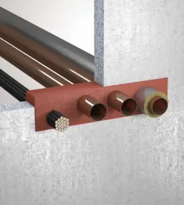 Cross-section of a wall showing pipes and cables passing through a fireproof barrier.