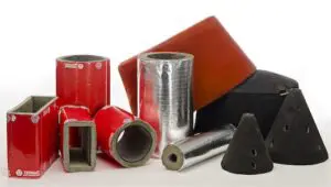 Various red, silver, and black insulated pipe and duct sections, including conical and rectangular shapes.