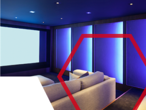Modern home theater room with a large screen, blue accent lighting, and a beige sofa.