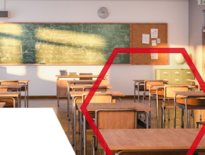 Empty classroom with wooden desks, a chalkboard with drawings, and sunlight streaming through the windows.
