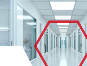Bright, modern hallway with glass offices, white walls, and a red hexagon overlay in the foreground.
