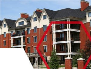 Four-story red-brick apartment building with balconies and white trim, outlined by a red hexagon shape.