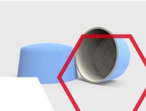 Two blue cylindrical objects, one upright and one on its side, with a red hexagon outline overlay.