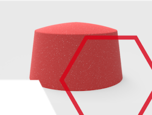 A red, speckled, dome-shaped object with red and green geometric shapes overlaid.