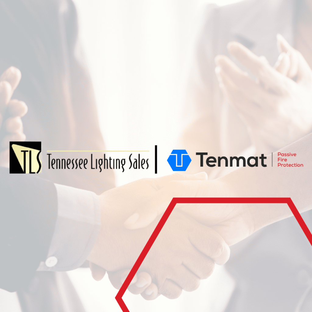 Close-up of two people shaking hands, with company logos and others clapping in the background.