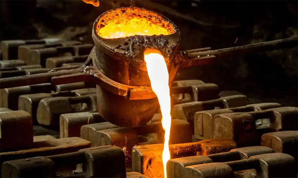 Molten metal being poured into a container.