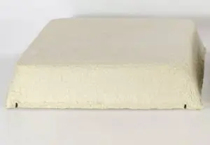 A square, beige, textured object with slightly tapered sides—resembling a troffer light cover—set against a plain white background.