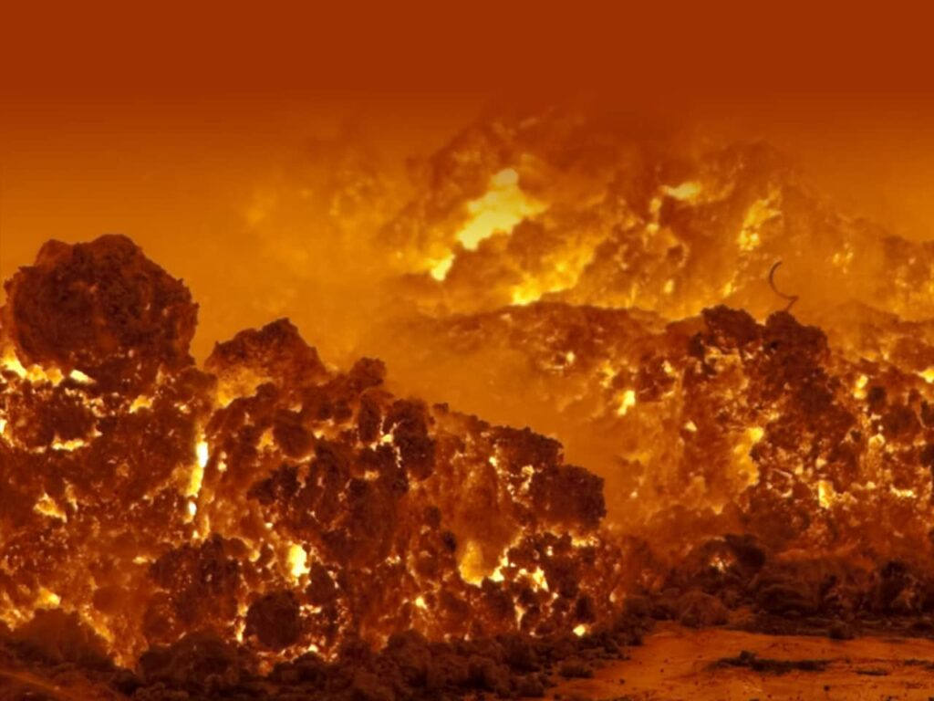 Hot lava and rocks glow with orange-yellow flames and smoke swirling in the background.